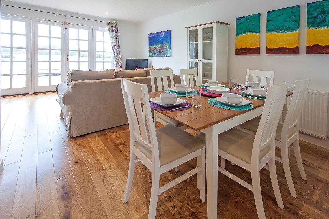 Lounge diner with patio doors leading onto the decking area
