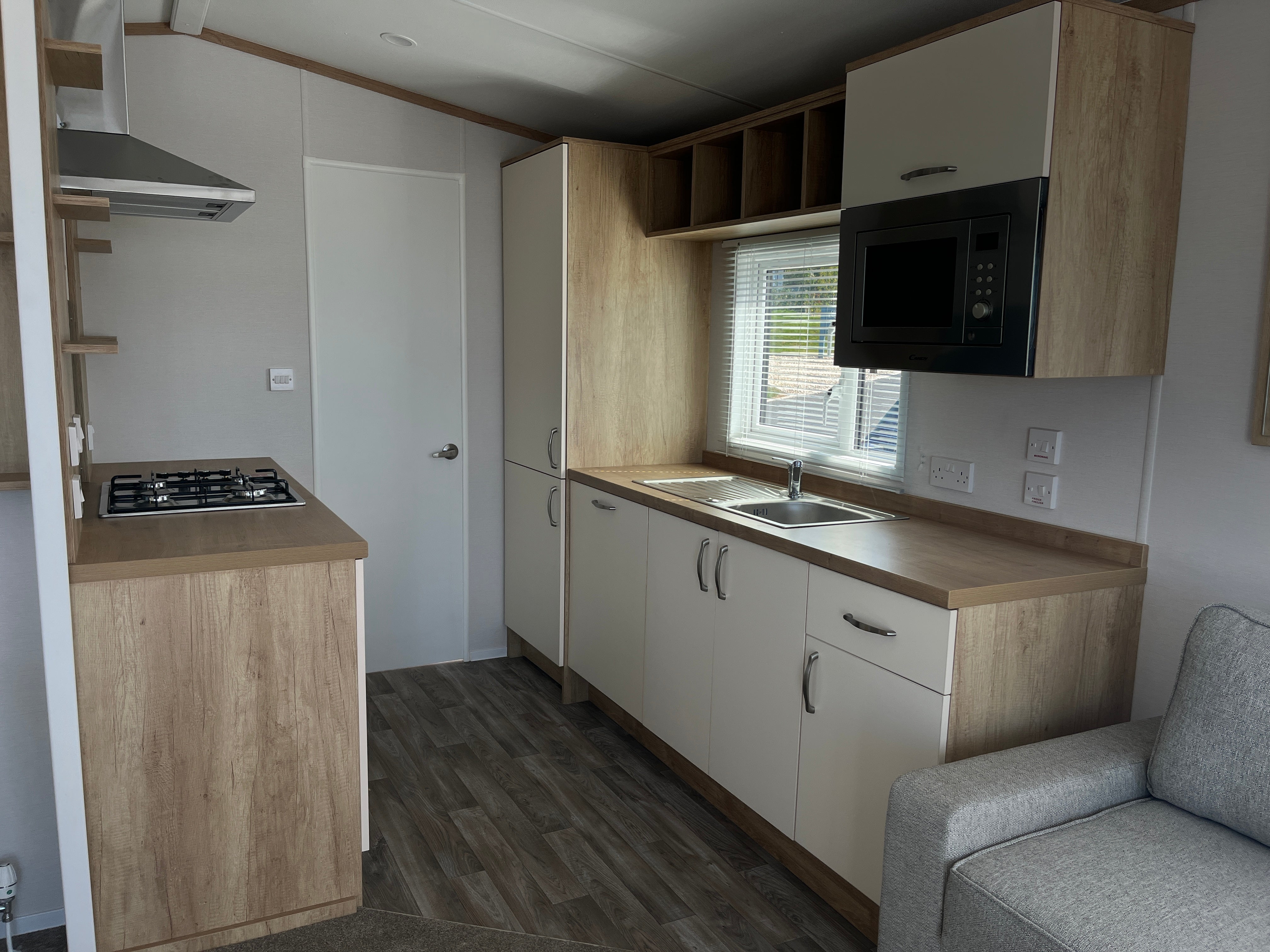 Kitchen with built in dishwasher, microwave and fridge freezer 