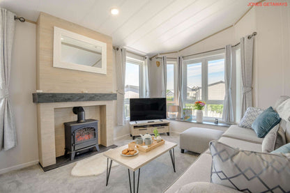 Lounge area with fireplace and smart tv